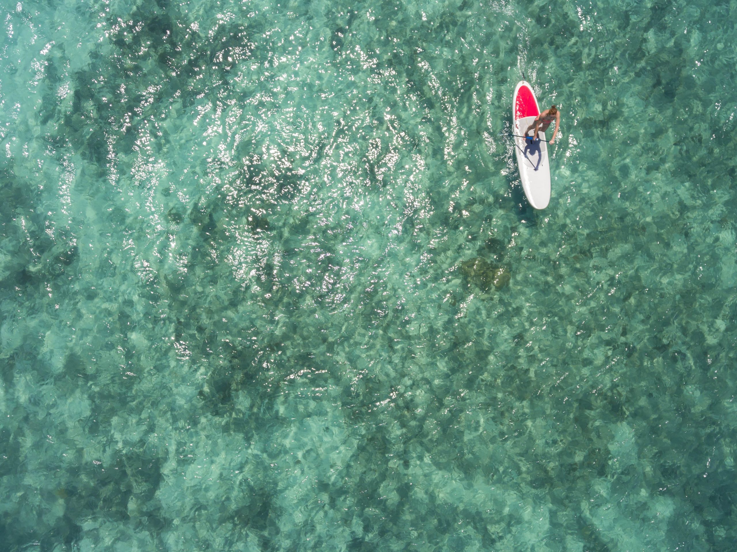 mauritius-young-woman-on-stand-up-paddling-board-2022-12-16-22-23-24-utc-min